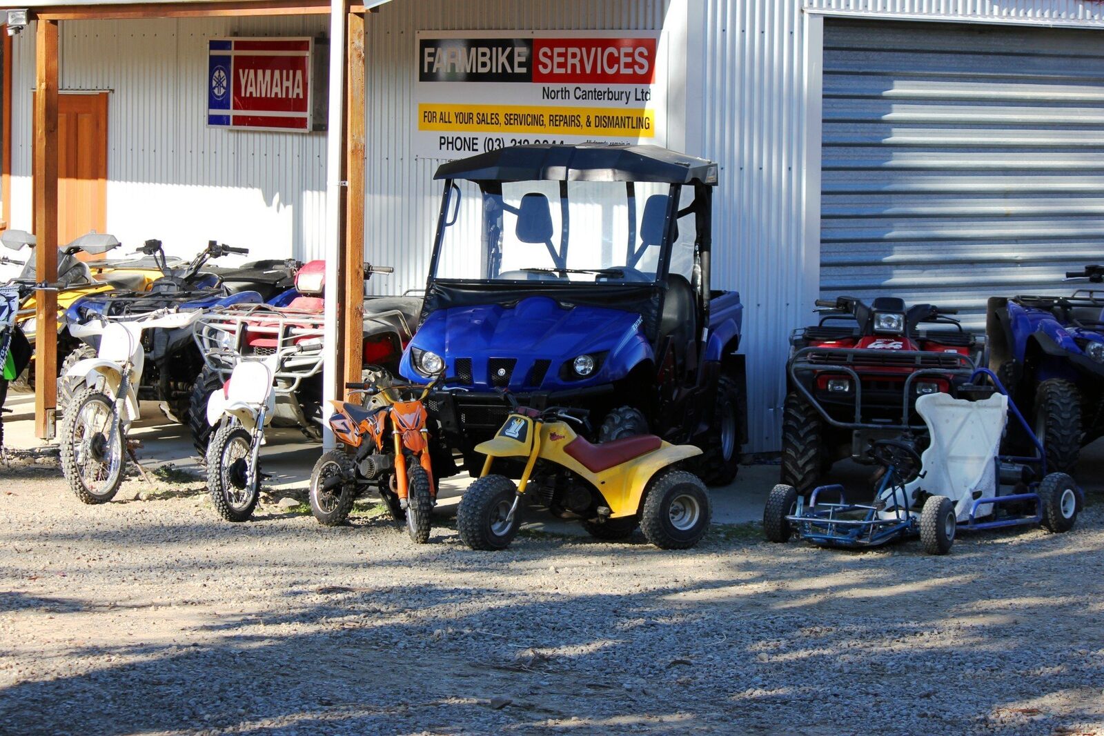 Farm quad bike and dirt bike on a Canterbury high country farm track at sunset
